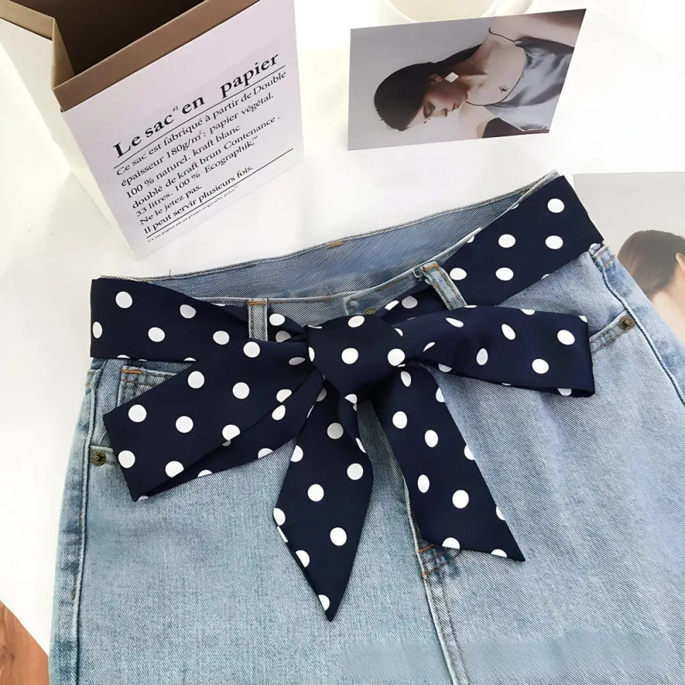 Blue denim skirt with polka dot scarf belt showcasing stylish polka dot detail