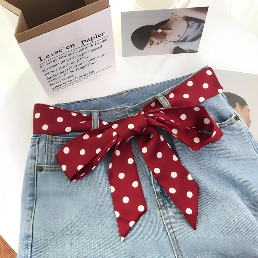 Blue denim skirt with polka dot scarf belt and red polka dot bow detail