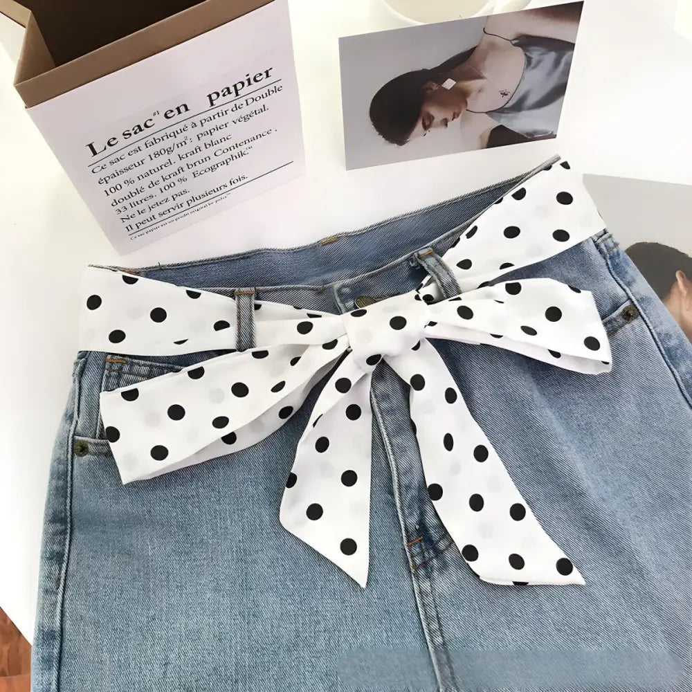 Blue denim skirt with polka dot scarf belt showcasing stylish polka dot accents