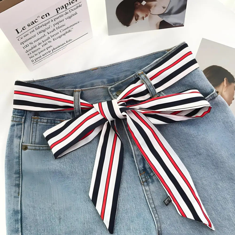 Light blue jeans with Santo Scarf Belt featuring striped ribbon and scarf belt detail