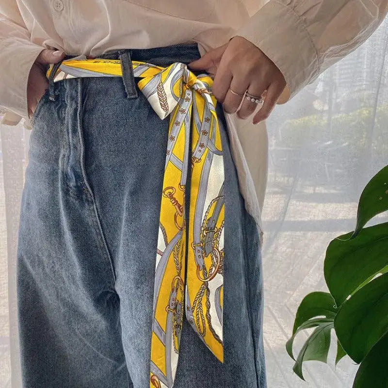 Yellow patterned scarf belt from Betina Scarf Belt collection with white pants