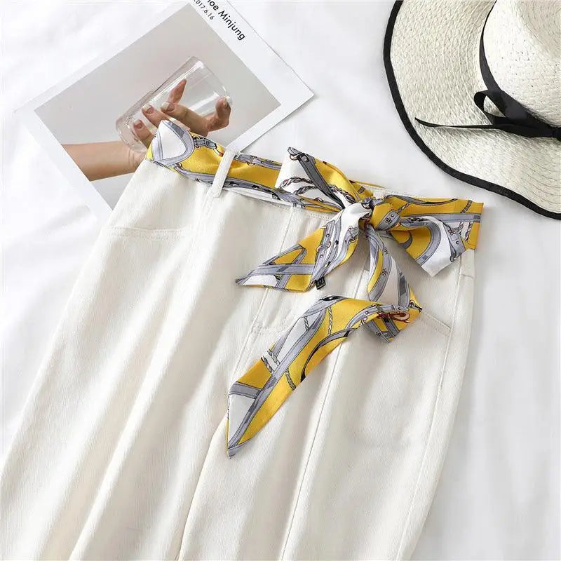 White pants with Betina scarf belt and yellow patterned Betina scarf