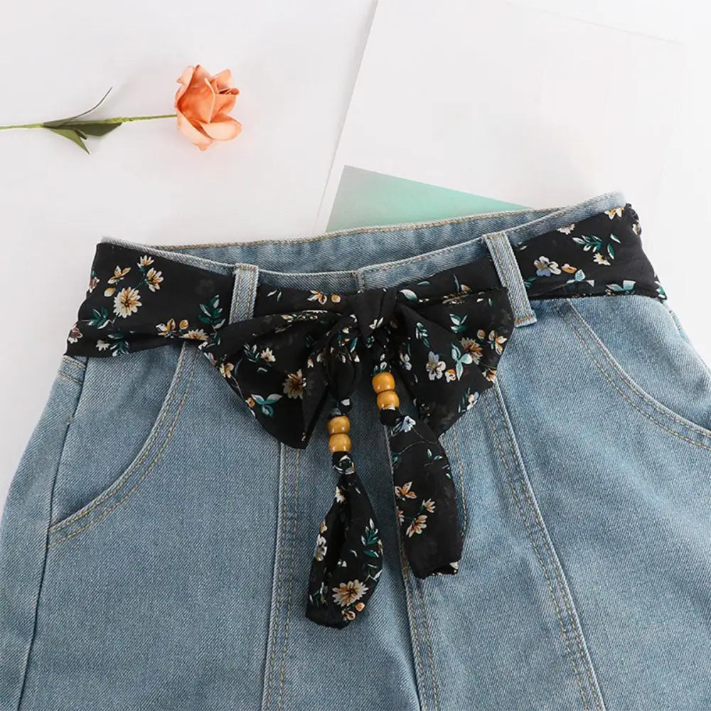 Denim skirt with floral scarf belt featuring Hokoupadia model scarf belt accessory