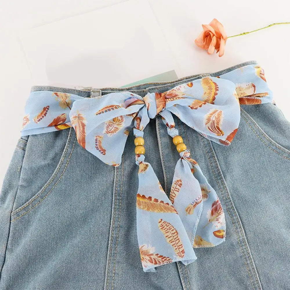 Denim skirt with patterned Hokoupadia model scarf belt for stylish look
