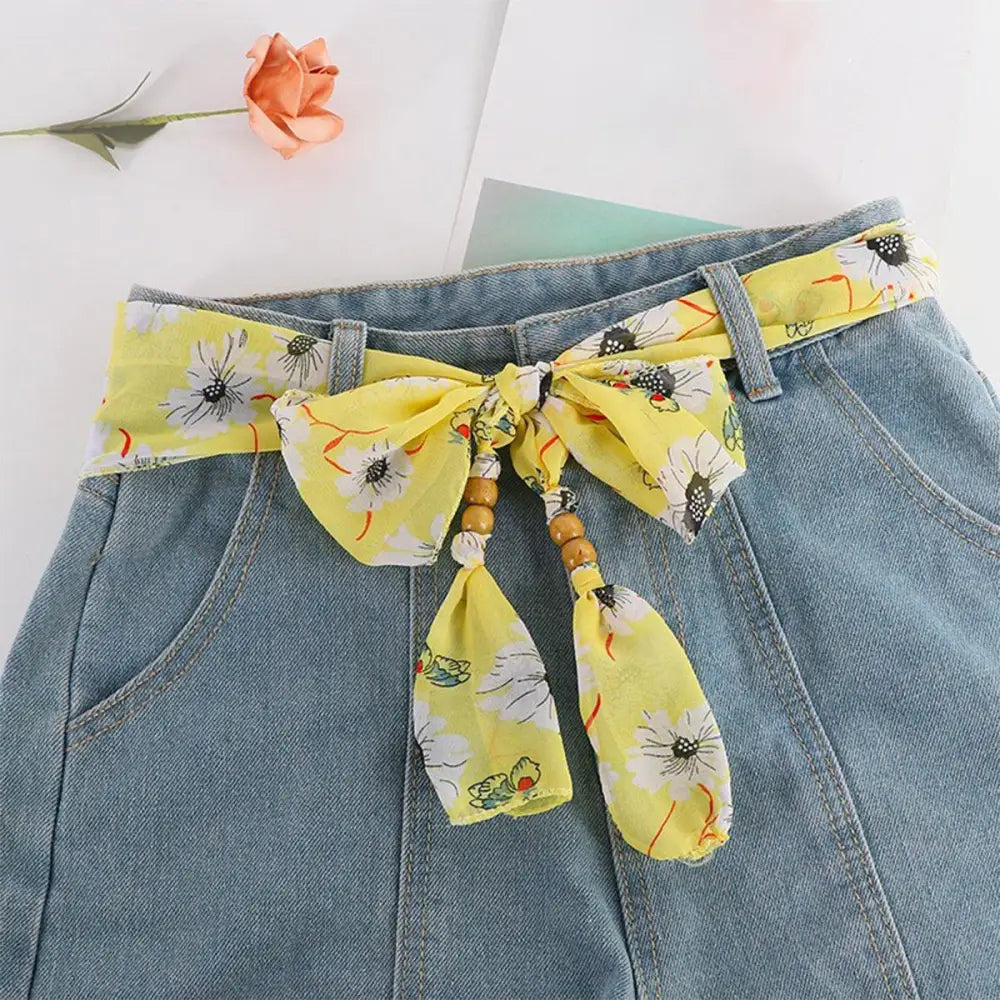 Denim skirt with floral sash and hokoupadia model scarf belt for stylish fashion