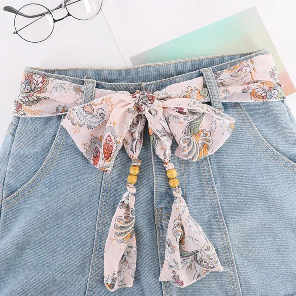 Denim skirt with floral scarf belt featuring Hokoupadia model scarf belt for stylish wear