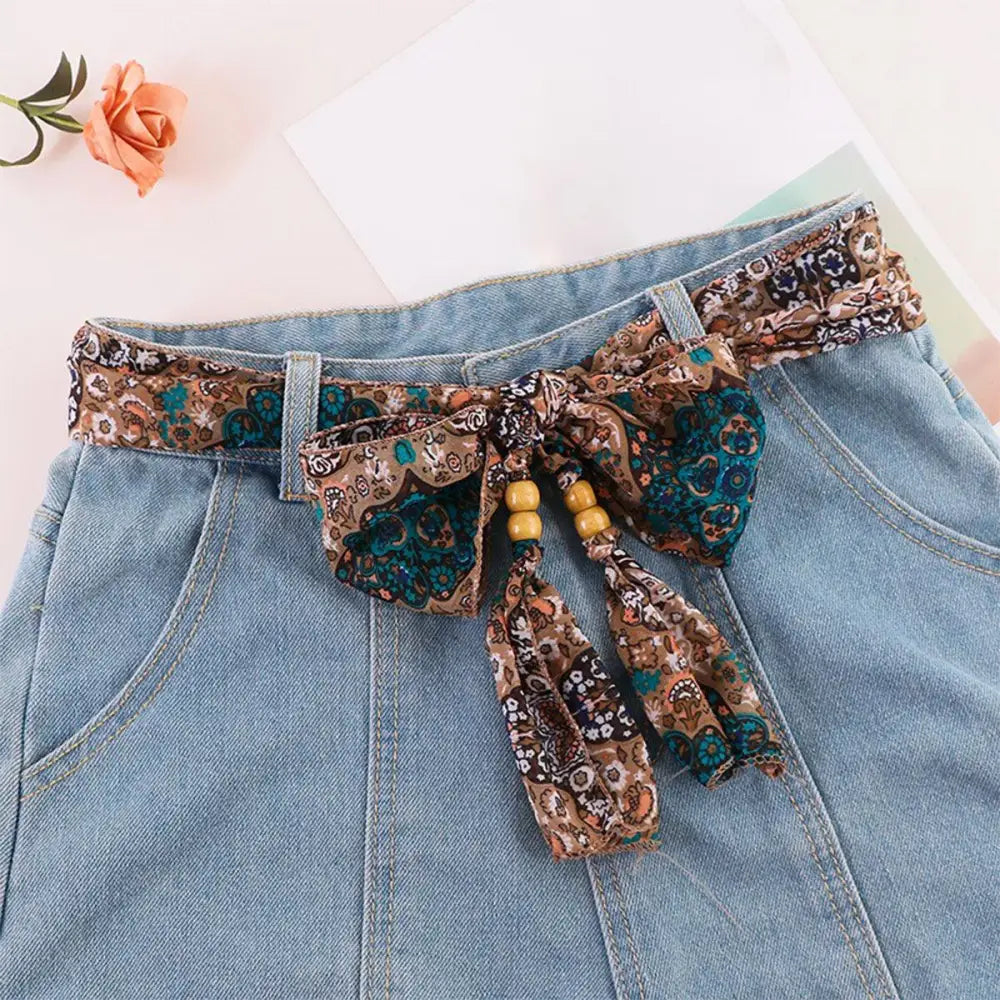 Denim skirt with patterned Hokoupadia model scarf belt for stylish fashion accessorizing