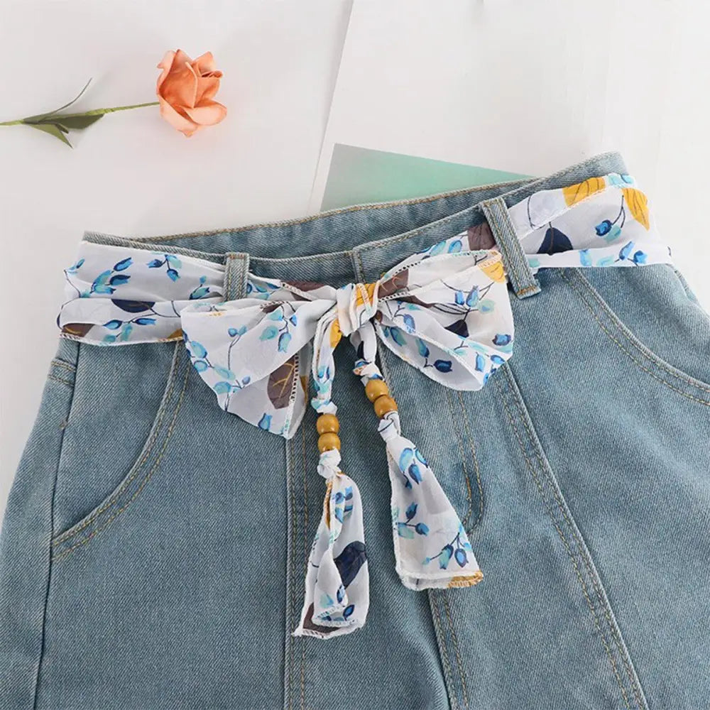 Denim skirt with floral scarf belt featuring Hokoupadia Model Scarf Belt design