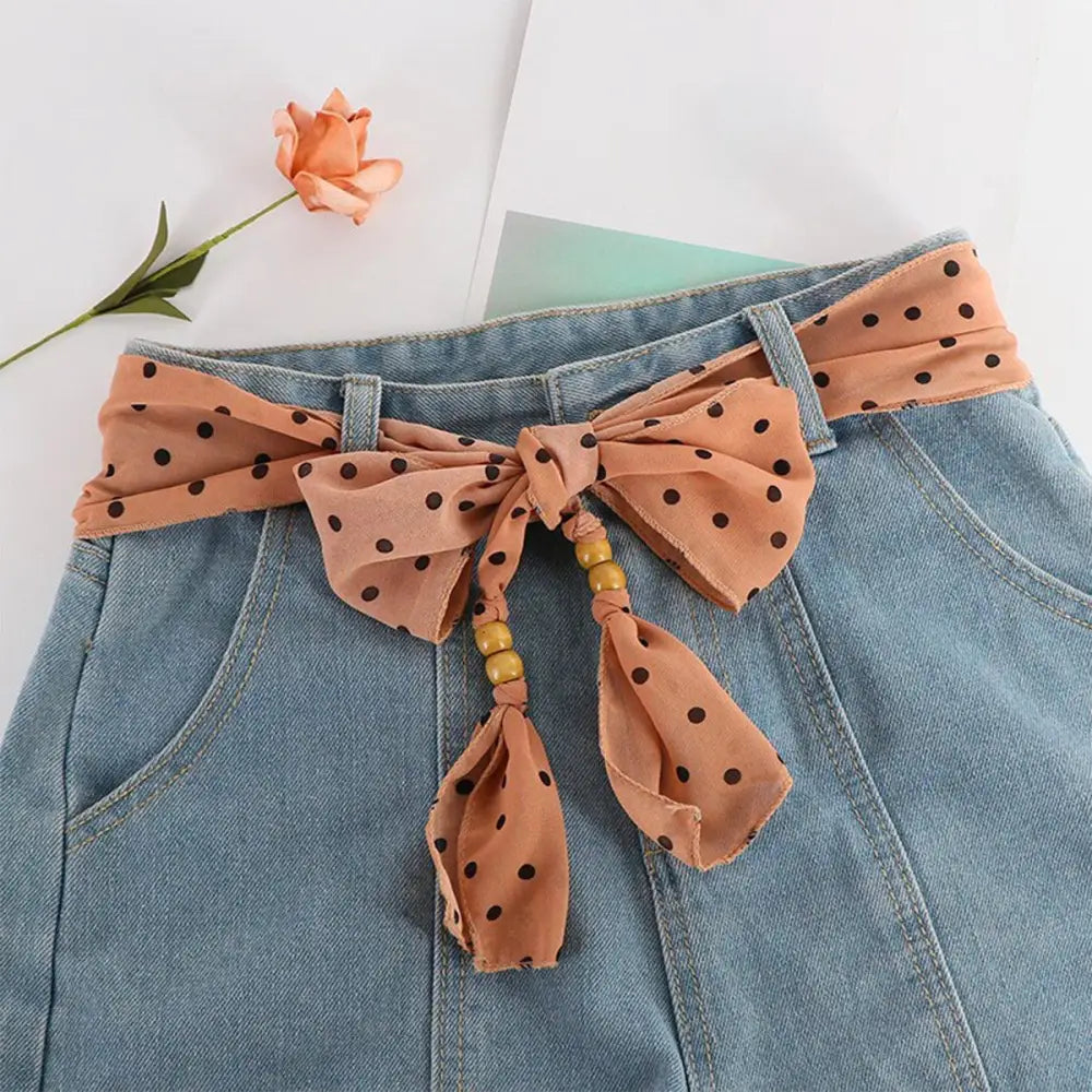 Denim skirt with polka dot bow belt featuring Hokoupadia model scarf belt