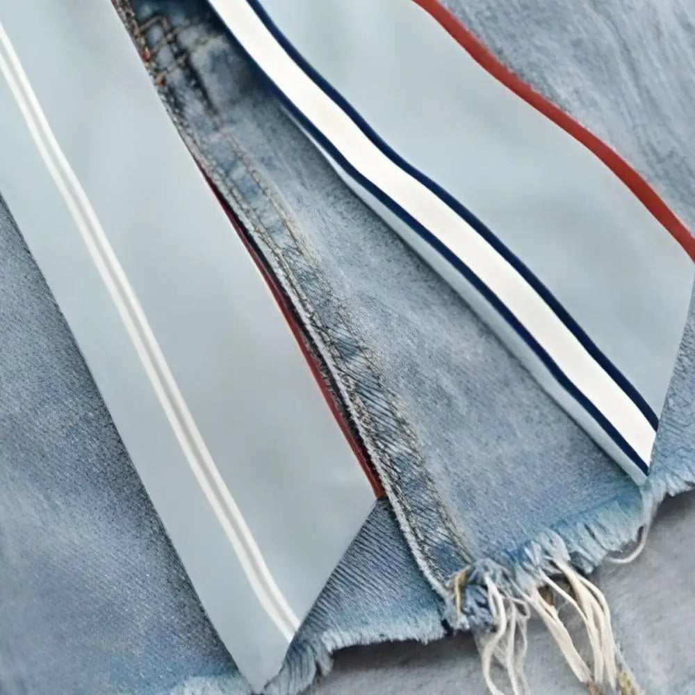 Distressed denim shorts with striped ribbons and Sea Breeze Scarf Belt for stylish look