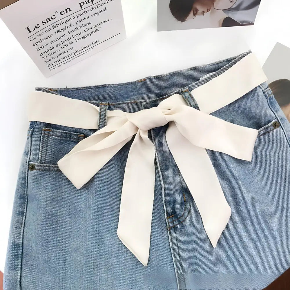 Denim shorts with stylish pink or black scarf belt for casual fashion