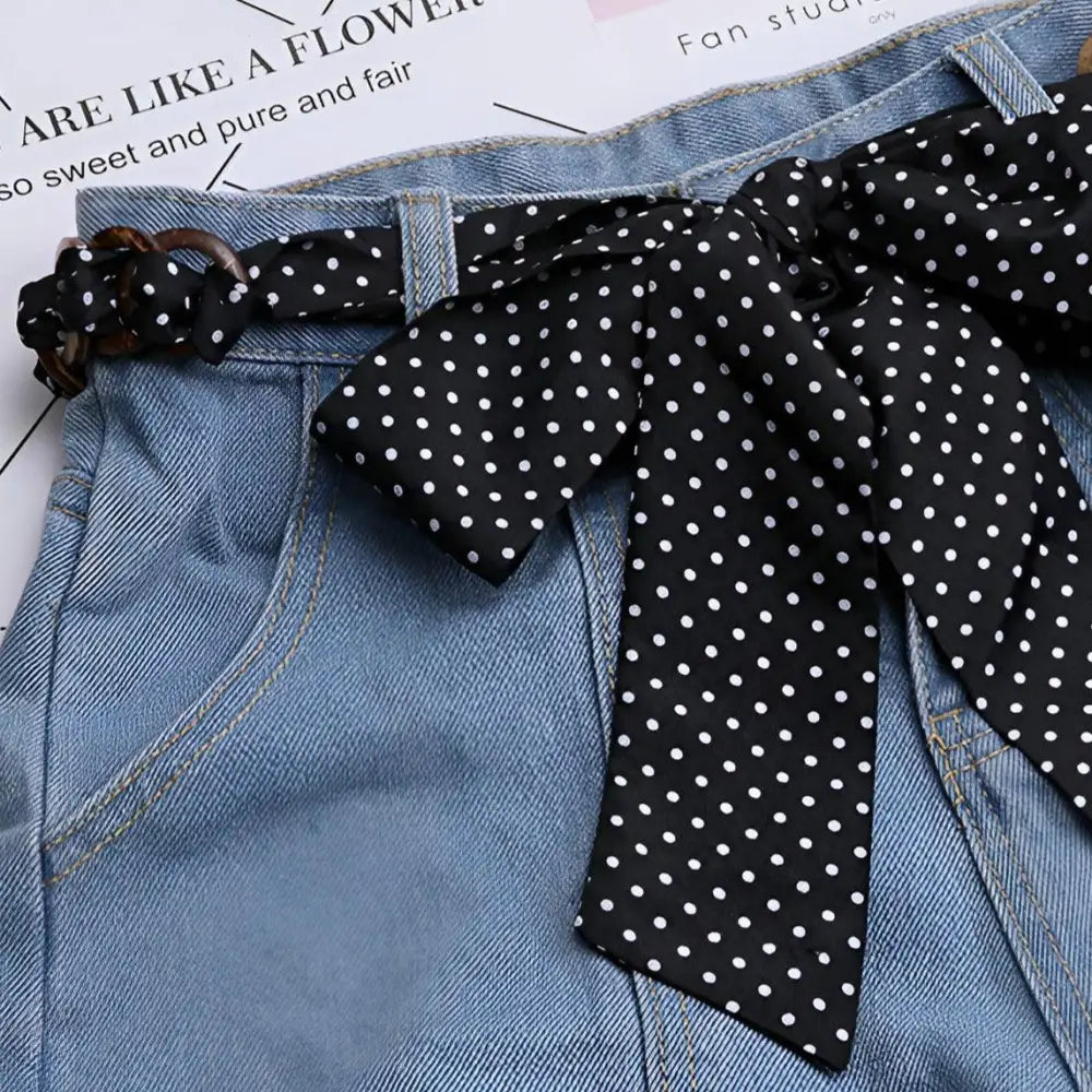 Blue denim shorts with polka dot Lisbeth Scarf Belt showcasing stylish accessories