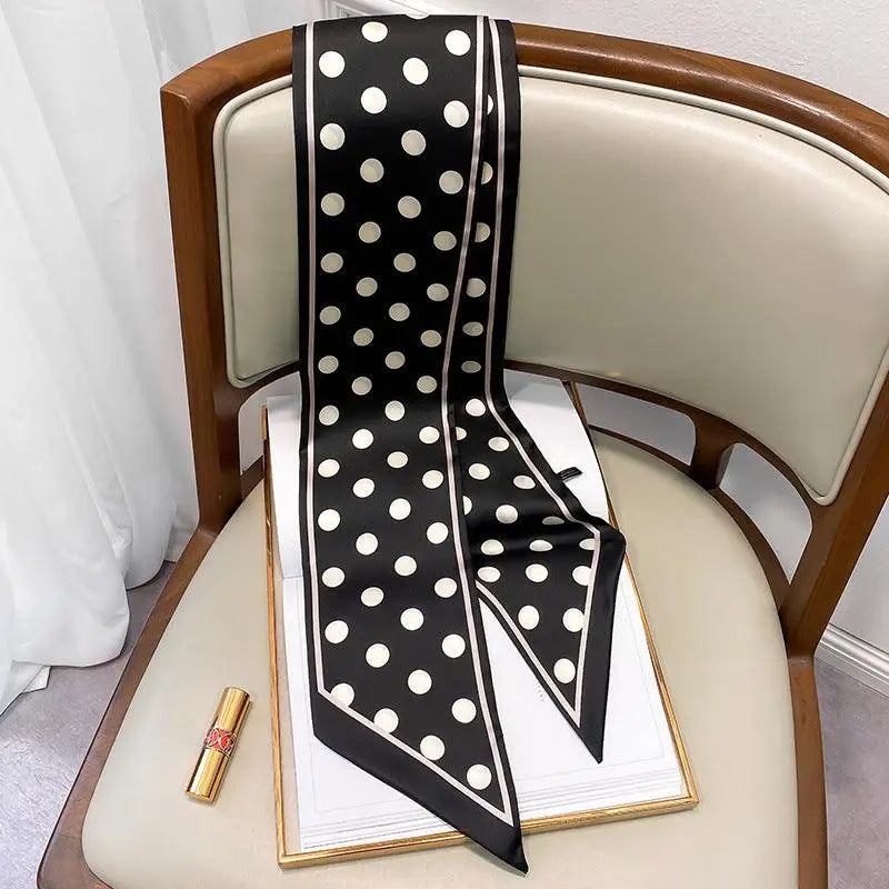 Black and white polka dotted silk scarf-belt displayed with White Shorts