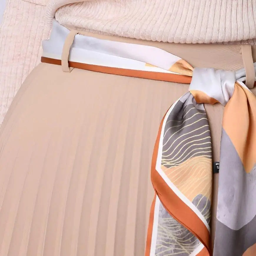 Pleated skirt with elegant silk scarf belt and patterned scarf belt for sophisticated style