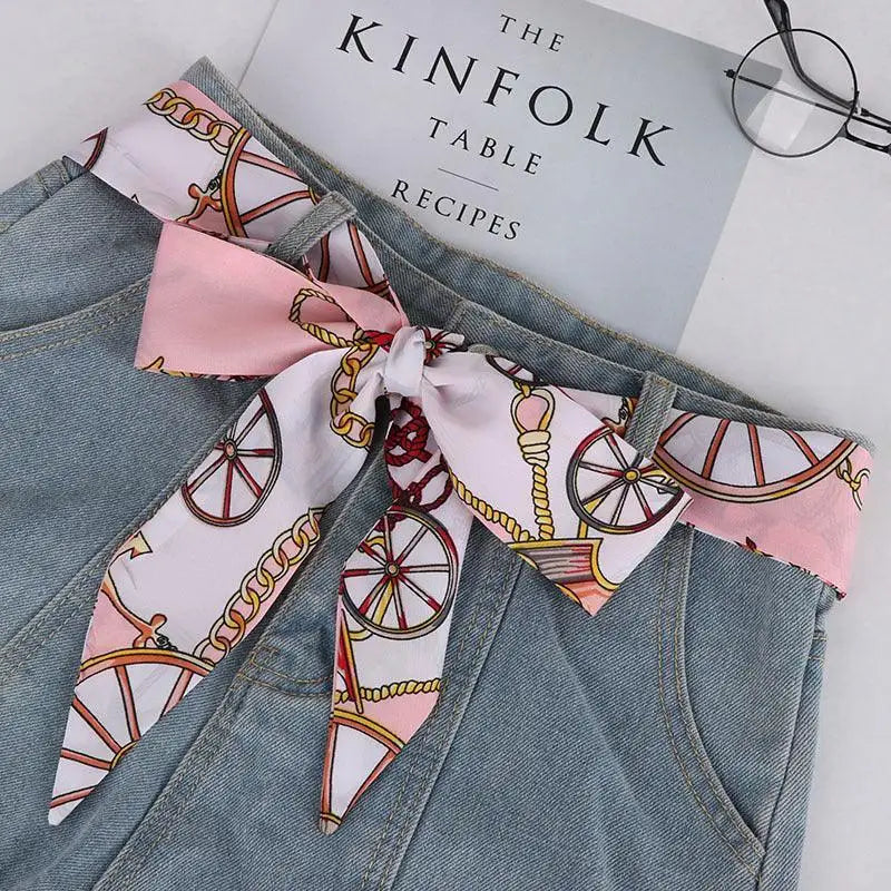 Denim skirt featuring a stylish silk scarf-belt for a sophisticated look