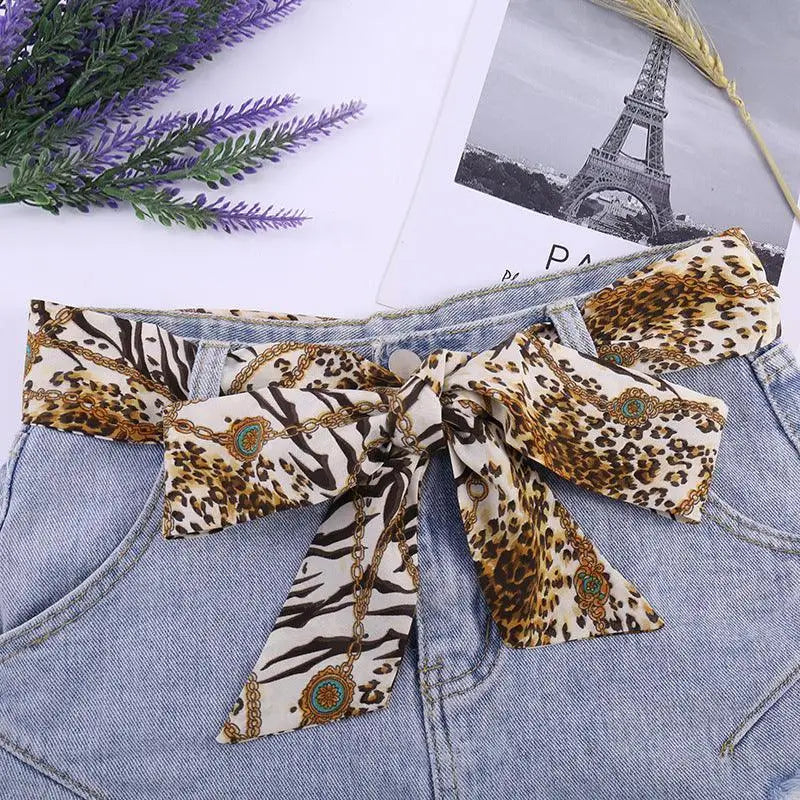 Denim shorts with Sanne Silk Scarf Belt featuring a stylish silk scarf belt design