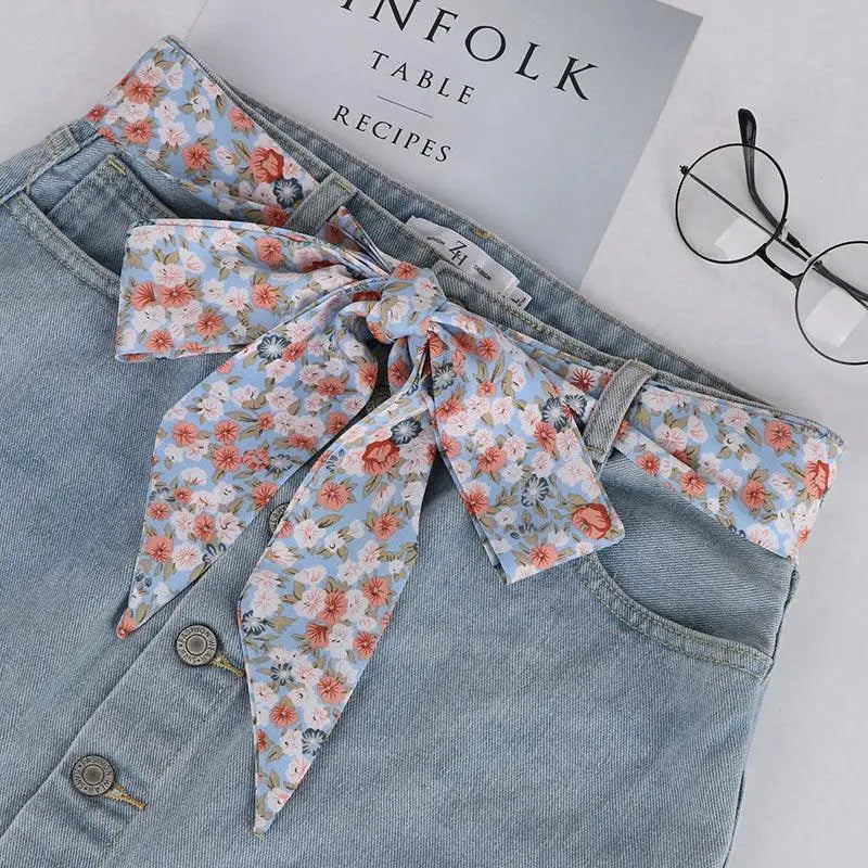 Light blue corduroy skirt with floral Yrsa silk scarf-belt for a feminine look