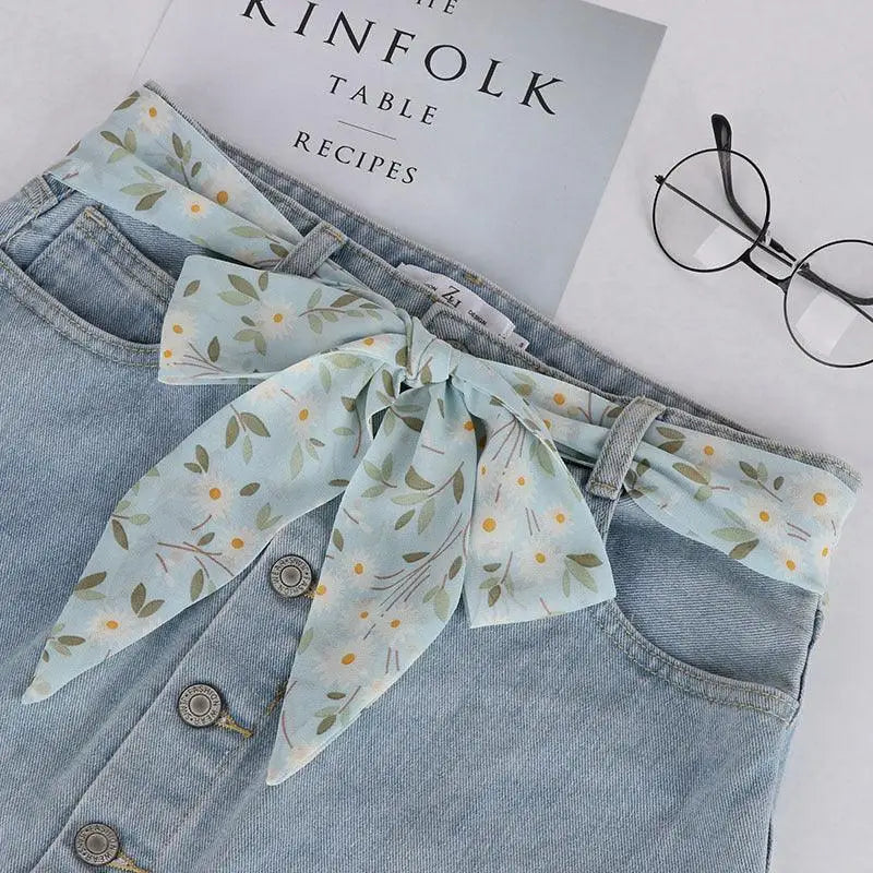 Light blue denim skirt with Yrsa silk scarf-belt for a feminine look