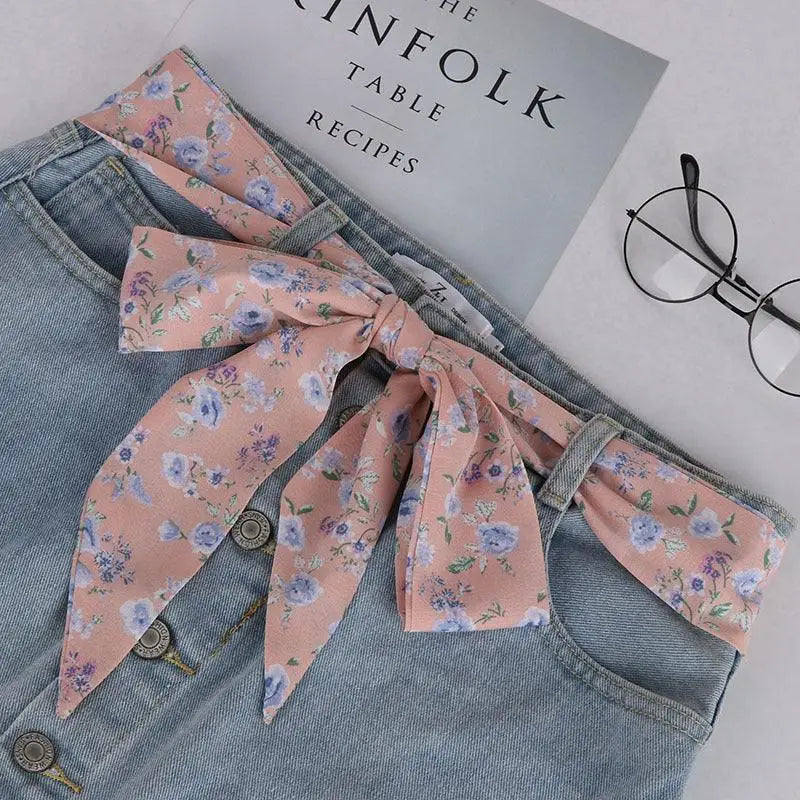 Denim skirt with floral ribbon belt and Yrsa silk scarf-belt for a femininelike look
