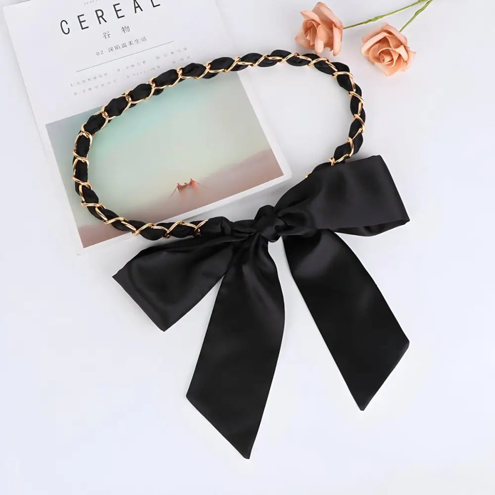 Black and gold chain headband with bow paired with Oriana silk scarf for elegant style