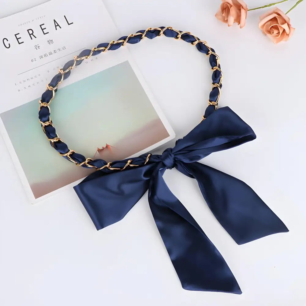 Navy blue bow headband paired with Oriana silk scarf for elegant style