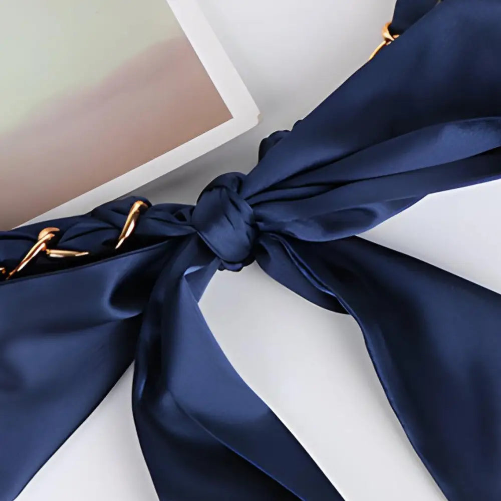 Navy blue Oriana silk scarf with gold chain detail for elegant headwear and accessories
