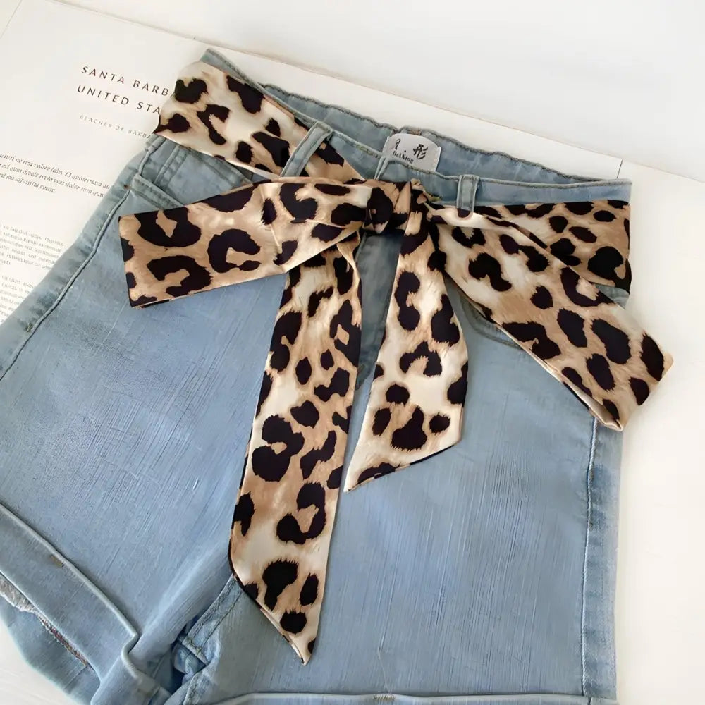 Blue denim shorts with leopard print sash showcasing Fosca Scarf Belt for stylish fashion