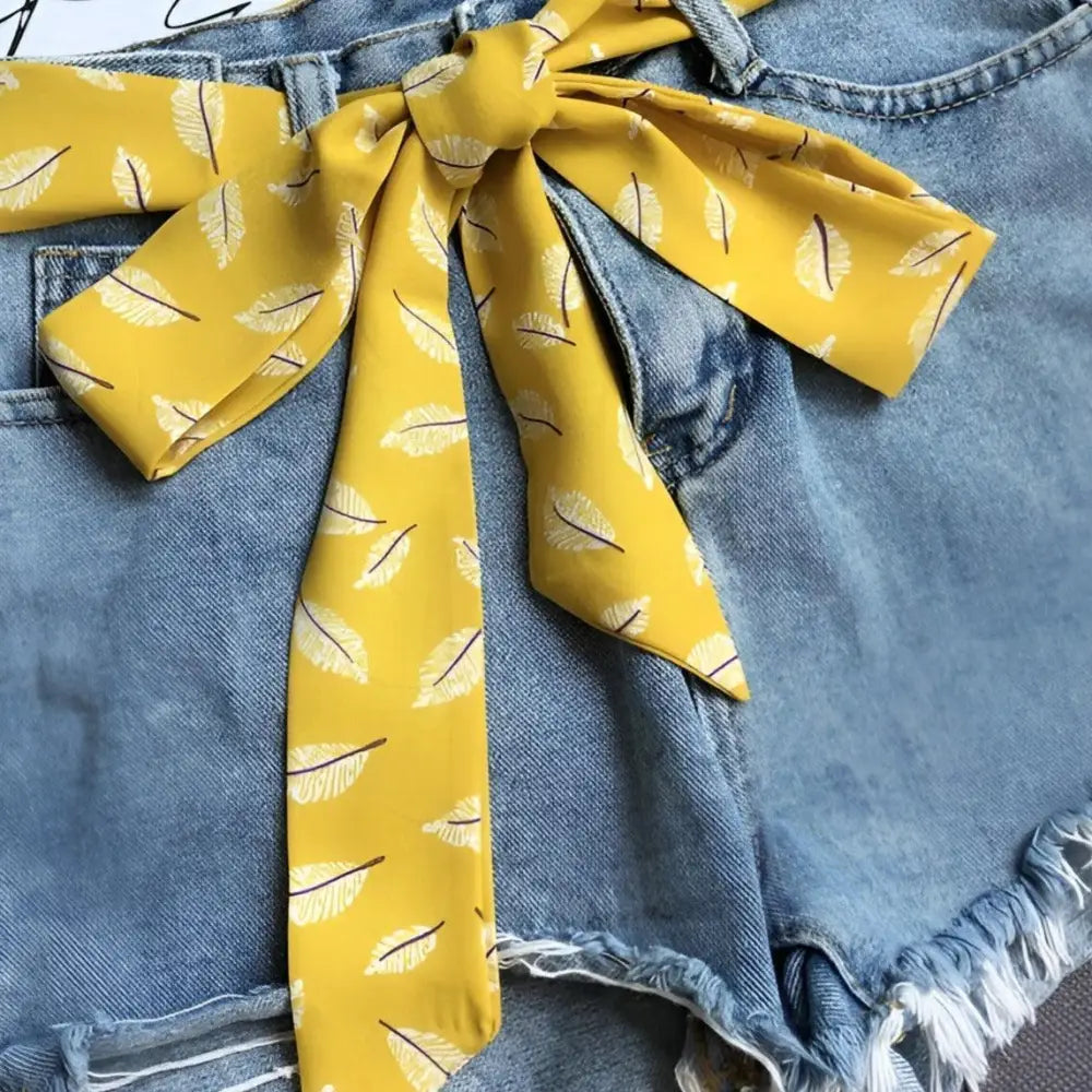 Denim shorts with Yellow Feather-Patterned Ipadia Scarf Belt for stylish summer wear