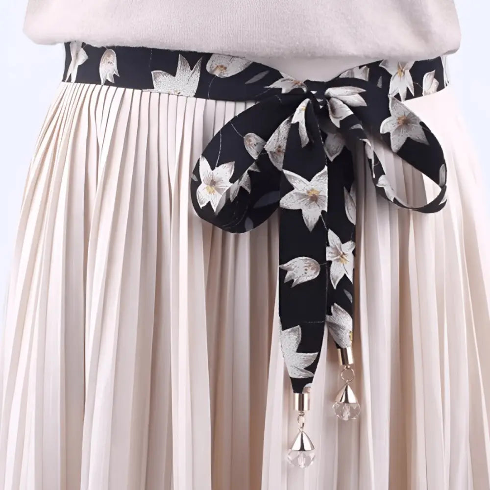 Pleated skirt with floral scarf belt accessory for casual style fashion look