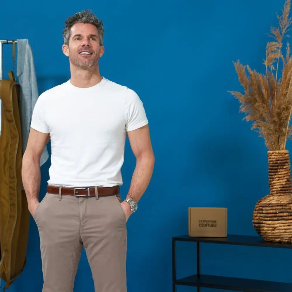 Man wearing a white t-shirt and khaki pants showcasing Winston Men’s Belt with robust metal buckle