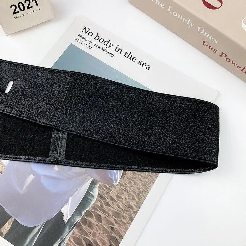 Wide black leather belt from Velthuria Belt Collection in stylish leather and faux leather styles