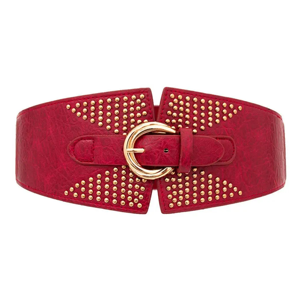 Red studded corset belt from Susanna Belt featured with patterned dress and waist belts