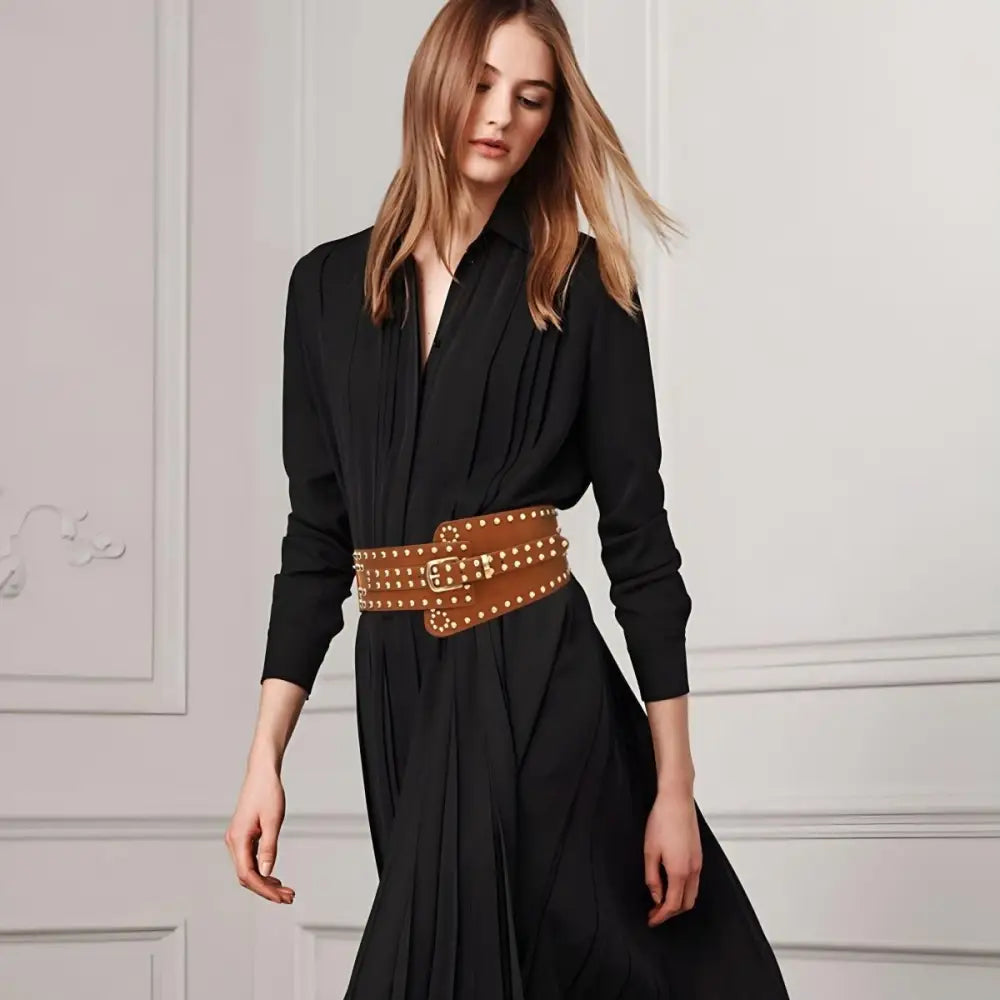 Black dress paired with a brown studded belt featuring a silver buckle
