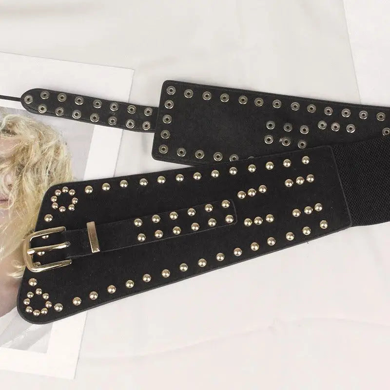 Black studded corset belt with a silver buckle for stylish fashion statement