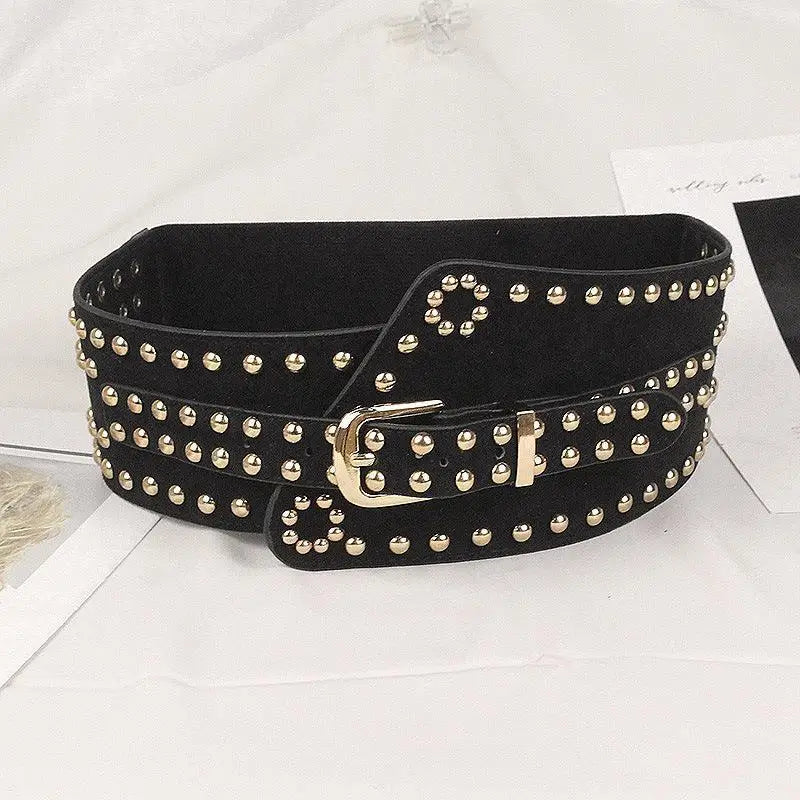 Black studded wide belt with silver buckle displayed in a product shot