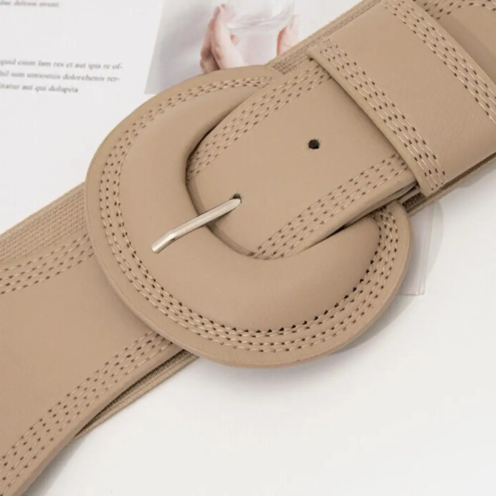 Beige Nikoline belt with wide design and large buckle for stylish women’s outfits