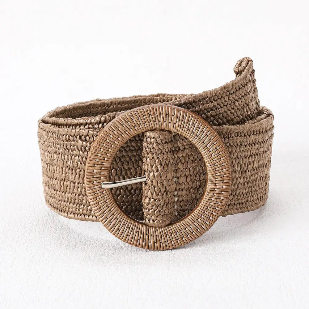 Woven brown magdalini belt with circular buckle made of synthetic raffia for stylish outfits