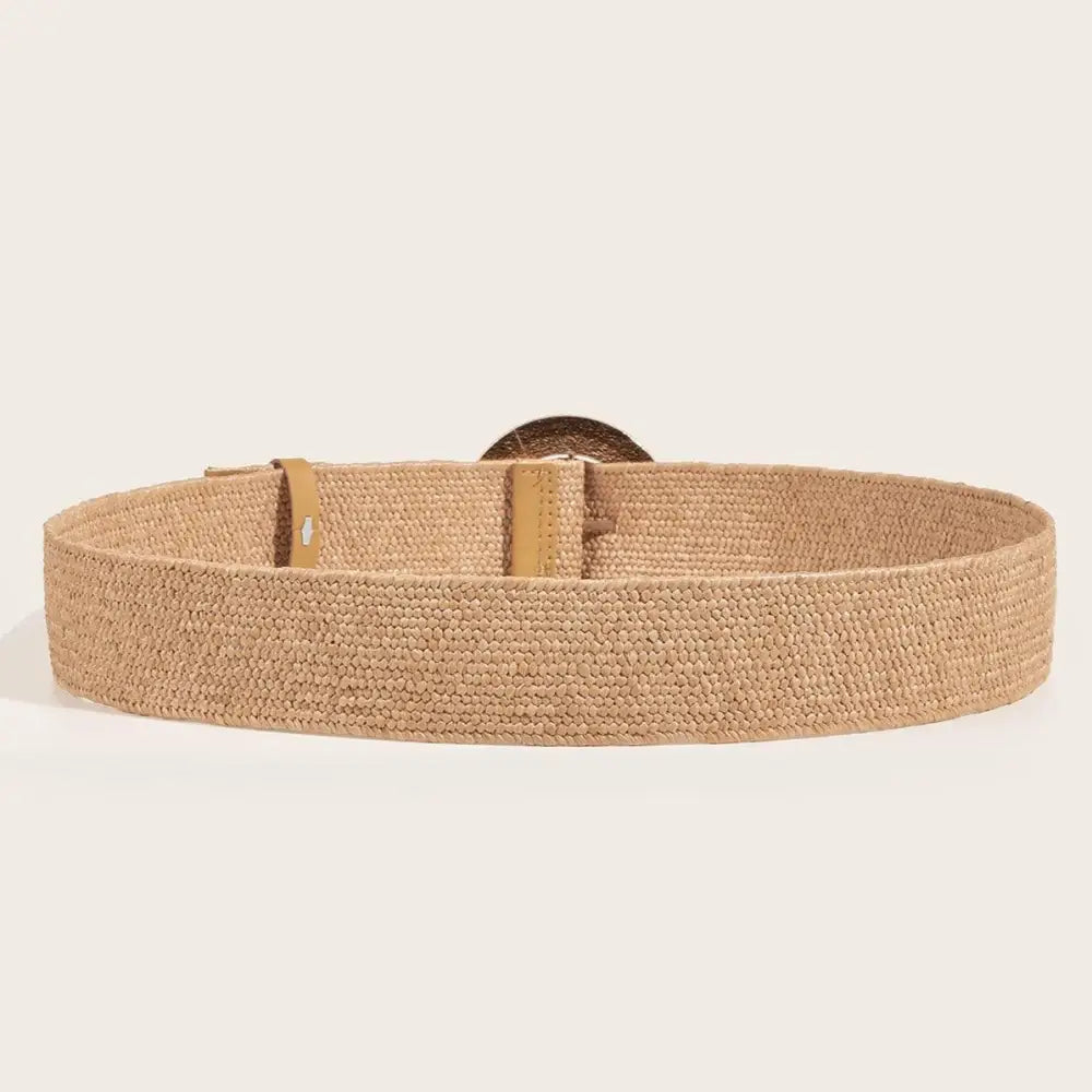 Woven tan straw Raffia belt with circular buckle displayed in product image