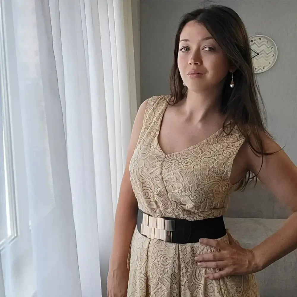 Woman wearing a lace dress with Helene belt from Floral Print Dress with Metallic Accents