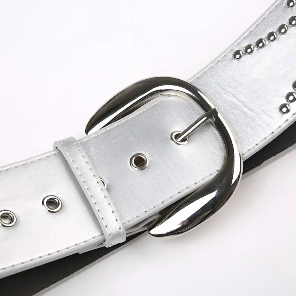 Silver studded belt with metal buckle displayed with Women’s Low-Rise Jeans and Camo Cargo Pants