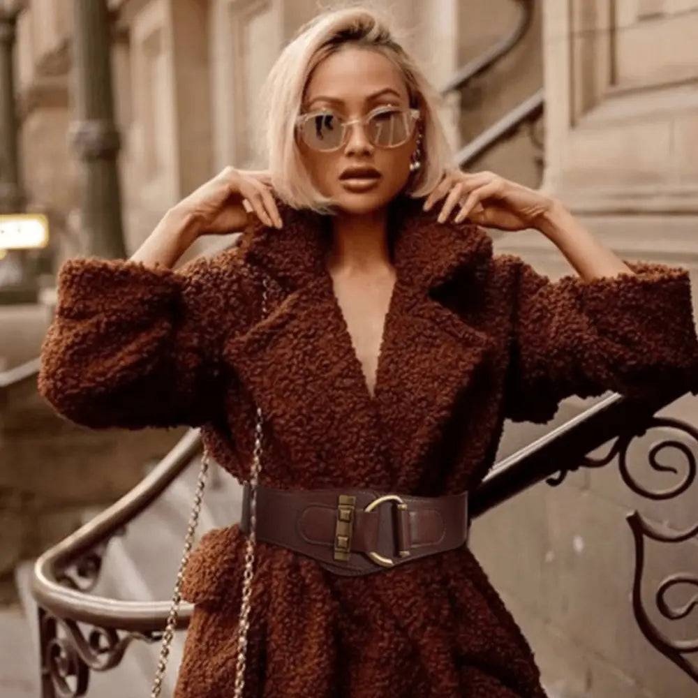 Brown teddy bear coat with wide belt and gold buckle details displayed in product image