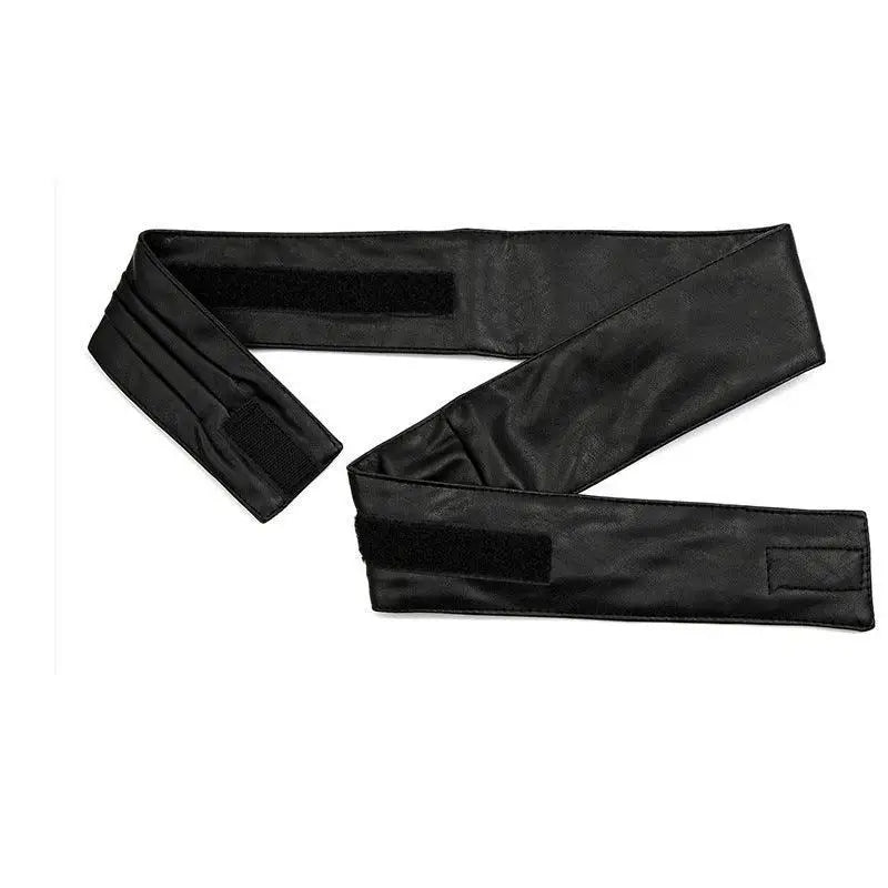 Black leather-like belt with velcro closures from the Utama Belt collection for elegant fashion