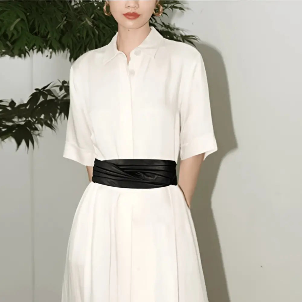 White dress with black sash and Utama belt featuring Burgundy and leather details