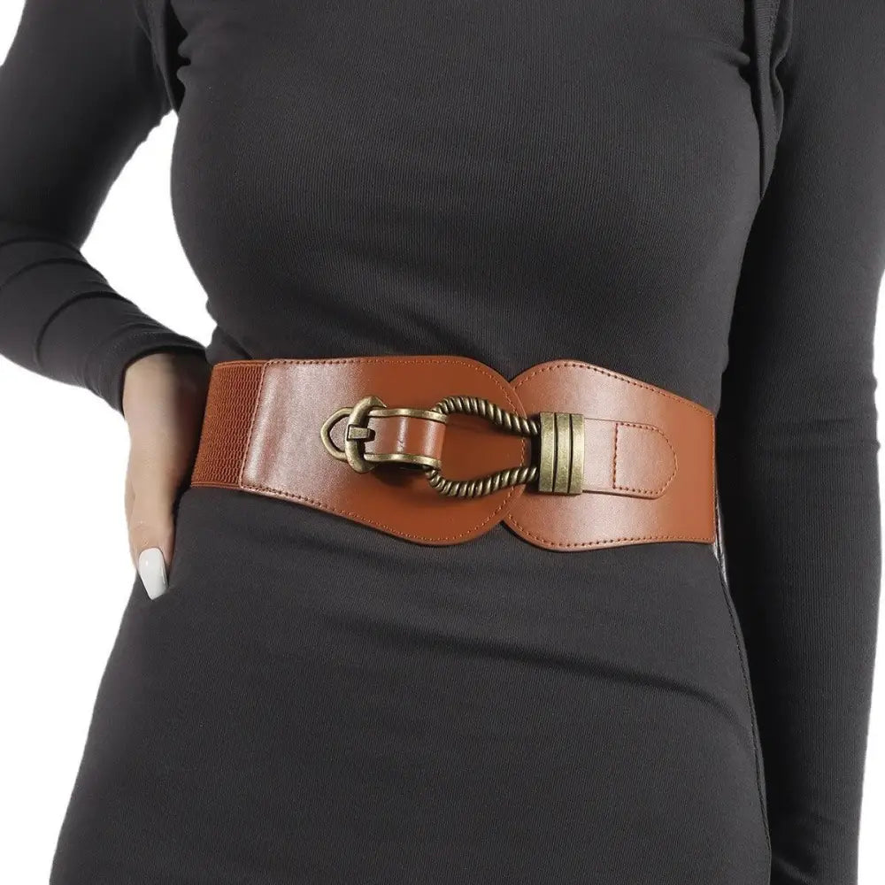 Brown elastic waist belt with leather accents and metal buckle for adjustable fit