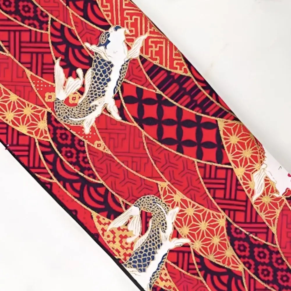 Red patterned fabric with koi fish showcasing a koï carp pattern for pattern obi belt