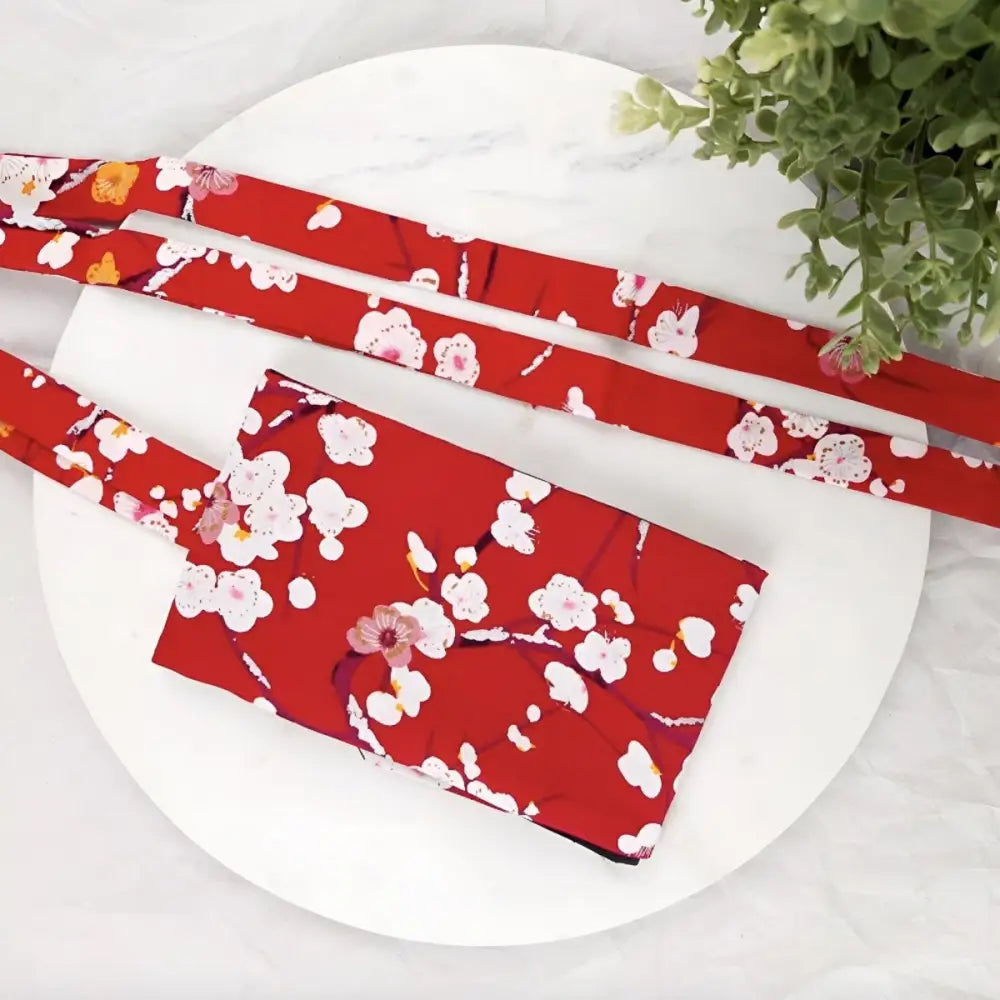 Red floral-patterned Hana Model handbag with straps showcasing plum blossom design