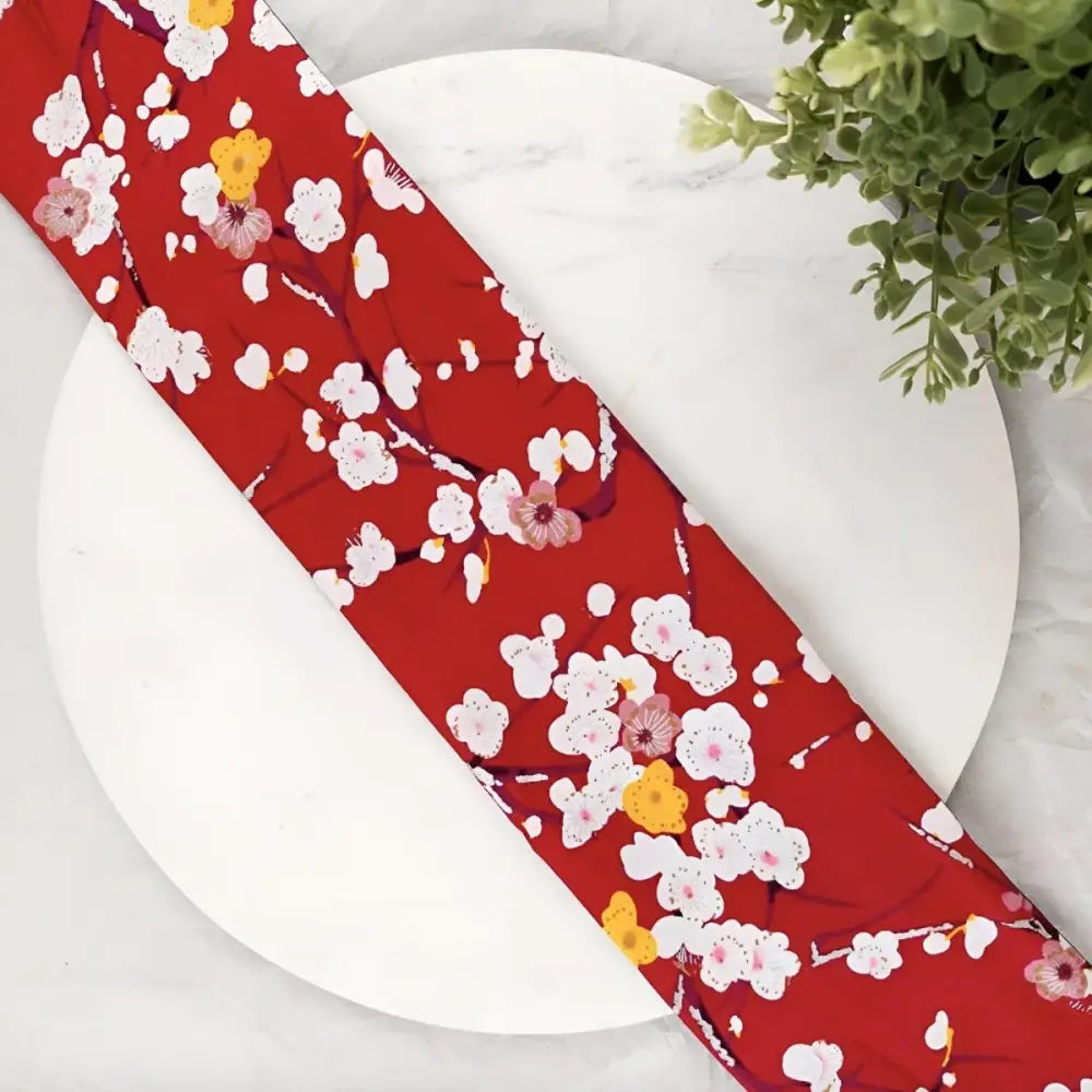 Red floral patterned fabric from Hana Model Obi Belt with Plum Blossom design