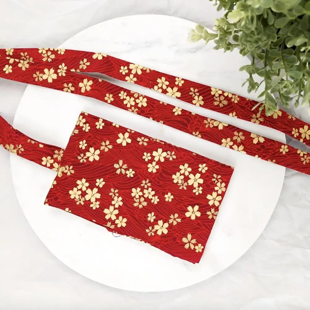 Red floral patterned fabric used for sakura flower-patterned obi and strap on the bag