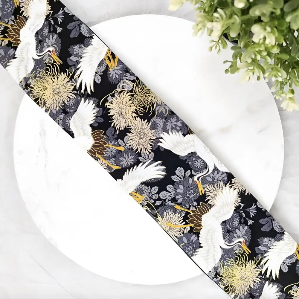 Black fabric with crane and floral pattern, ideal for obi mita belt or mita belt design