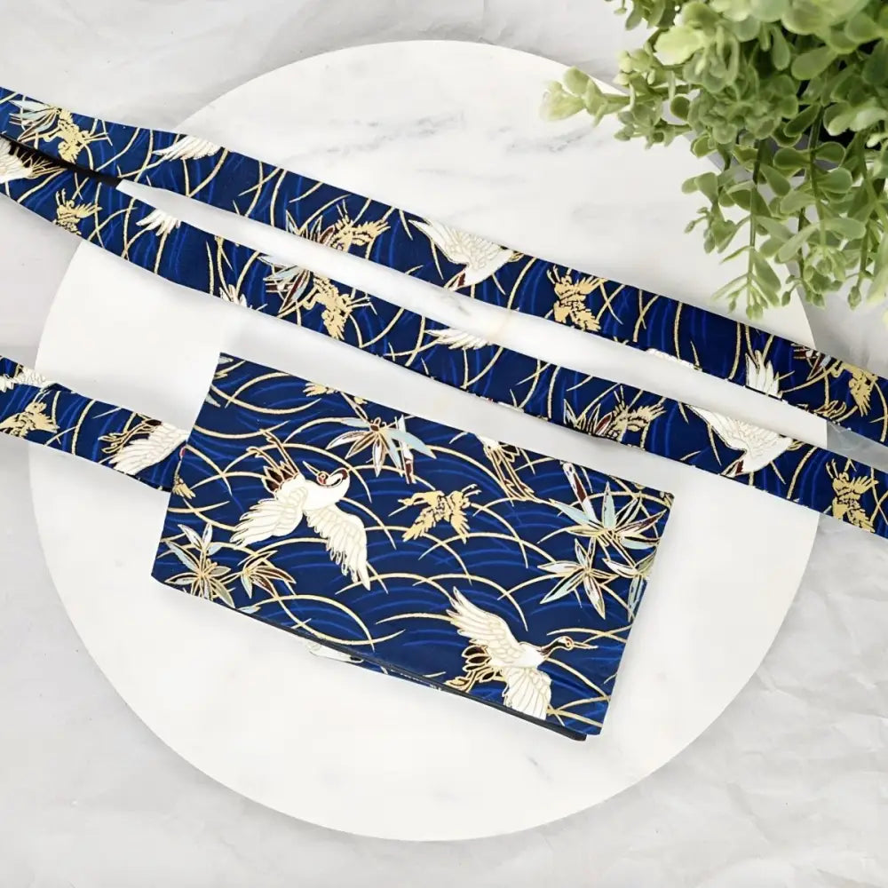 Blue crane-patterned lanyard and wallet with obi sash included in the set